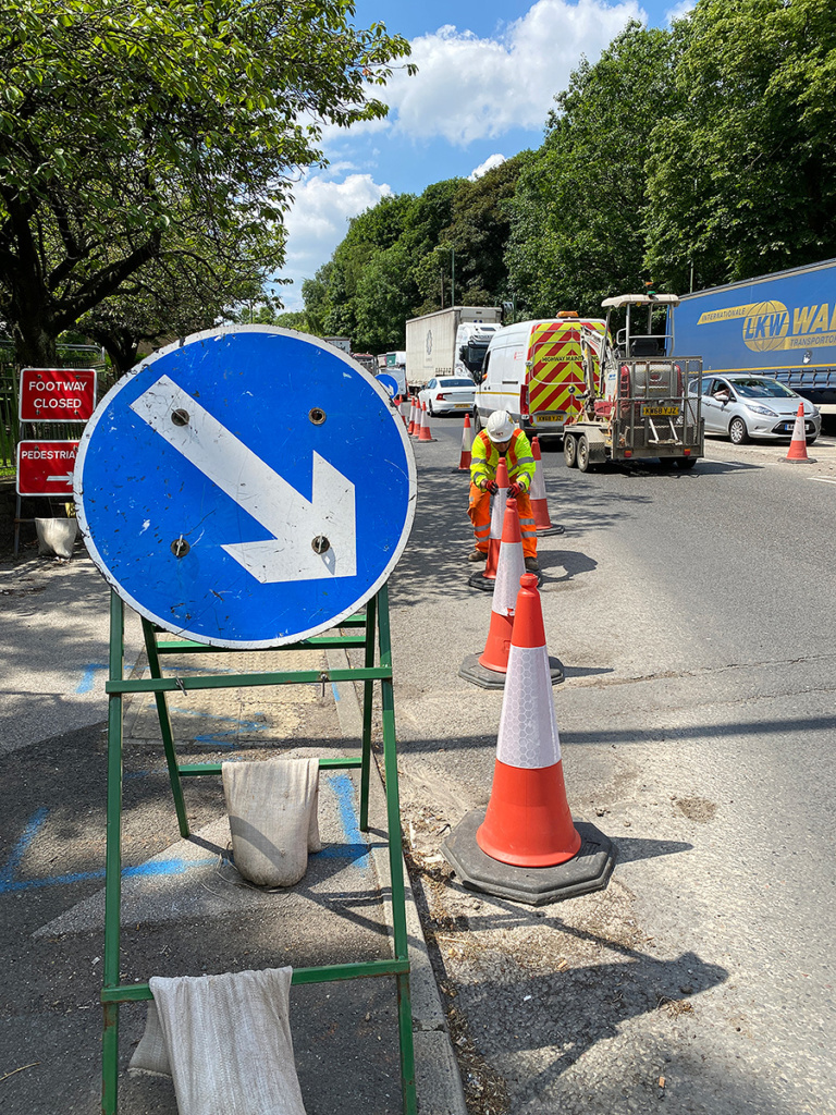 Major Project site, with Go Traffic Management employee deploying cones with keep right signage. 